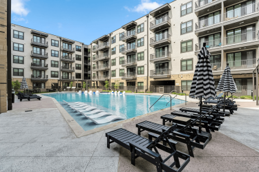 The Briarly apartment community swimming pool with ample deck seating